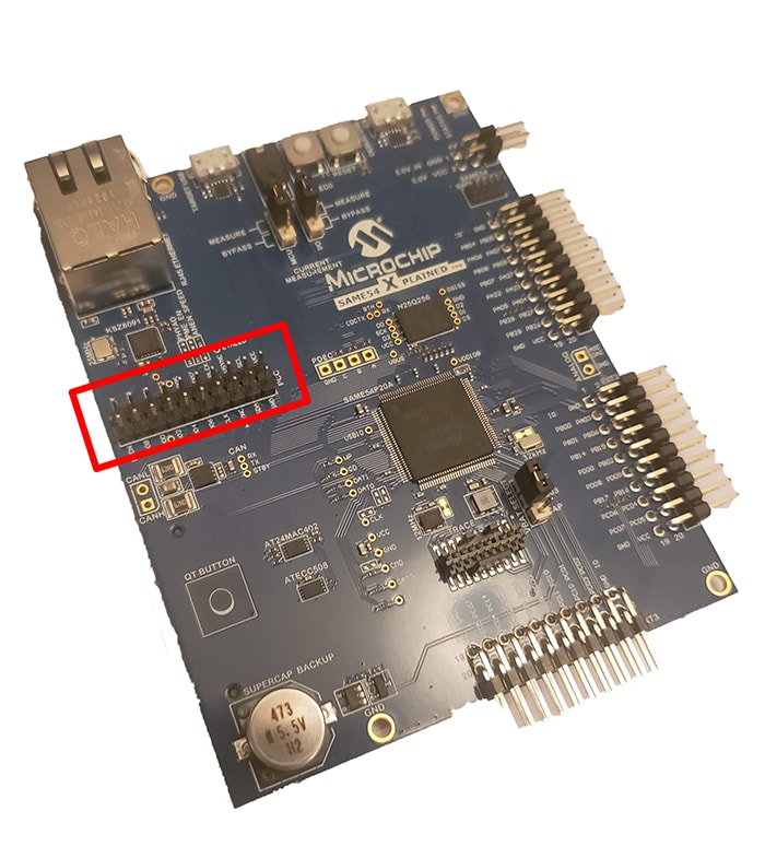 The SAM E54 development board with male headers for the camera interface now soldered on.