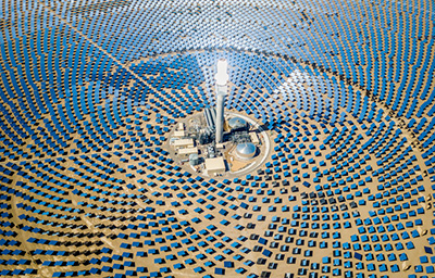 High Aerial view of large solar thermal power plant farm in the desert. Solar thermal power station. Nevada, USA.