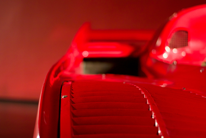 
Focusing on the interior of a Ferrari red supercar on a red background